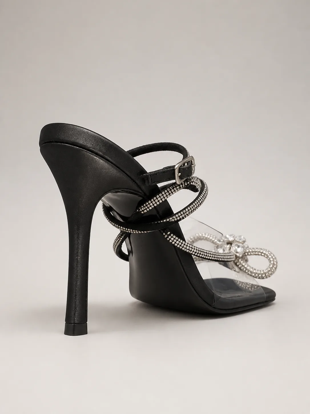 BLACK RHINESTONE BOW CLEAR STRAP SANDALS — photo 1