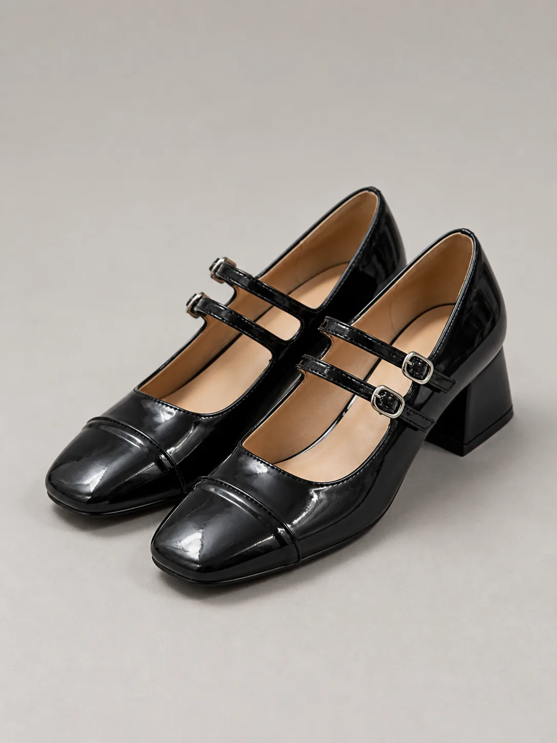 BLACK PATENT DOUBLE-STRAP MARY JANE HEELS